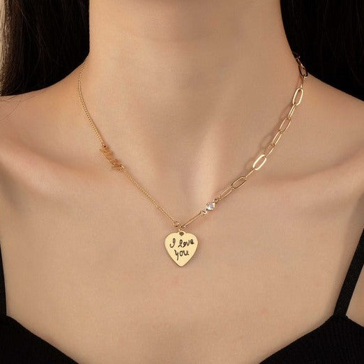 Asymmetric delicate necklace with heart pendant